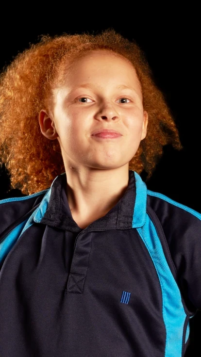 Girl in PE Kit with ball