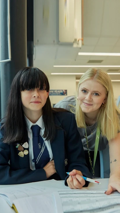 Teacher with secondary school student